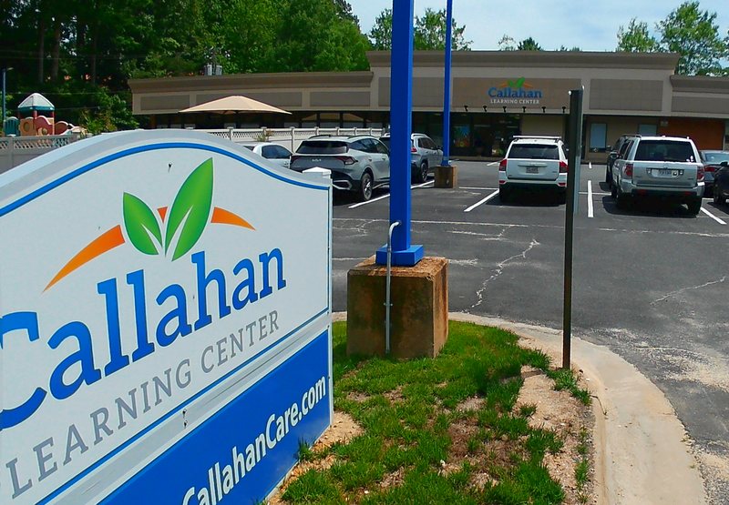 The Callahan Learning Center monument sign at the Falmouth parking-lot entrance, with the center building beyond.